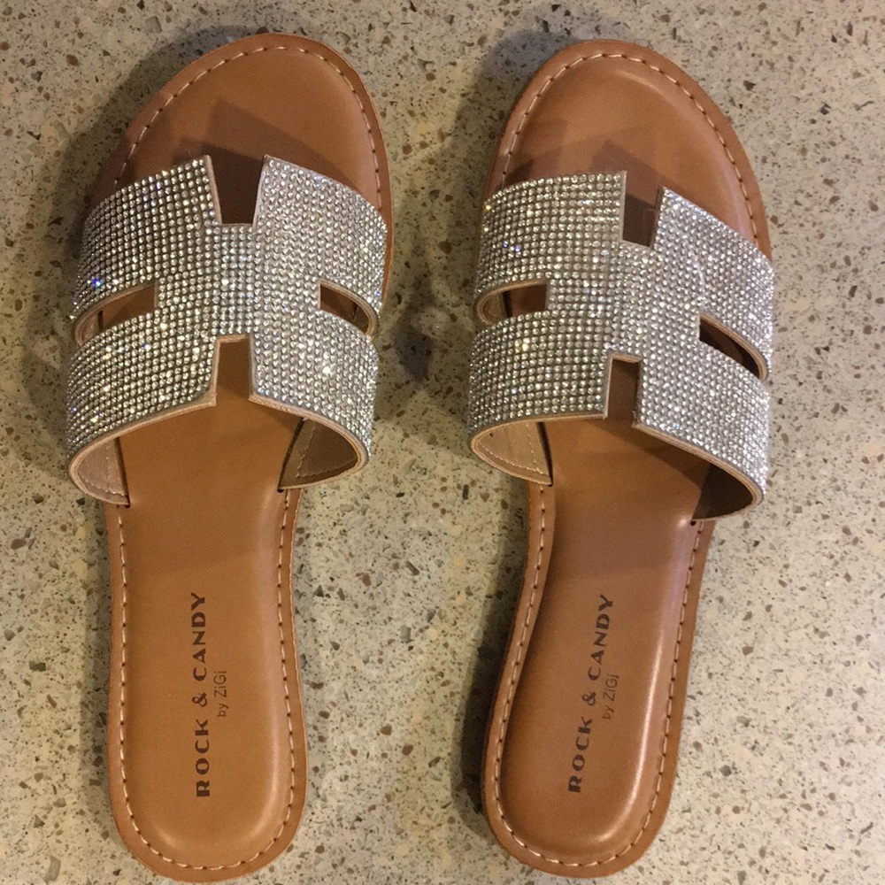 A NEW pair of “Rock & Candy” sandals